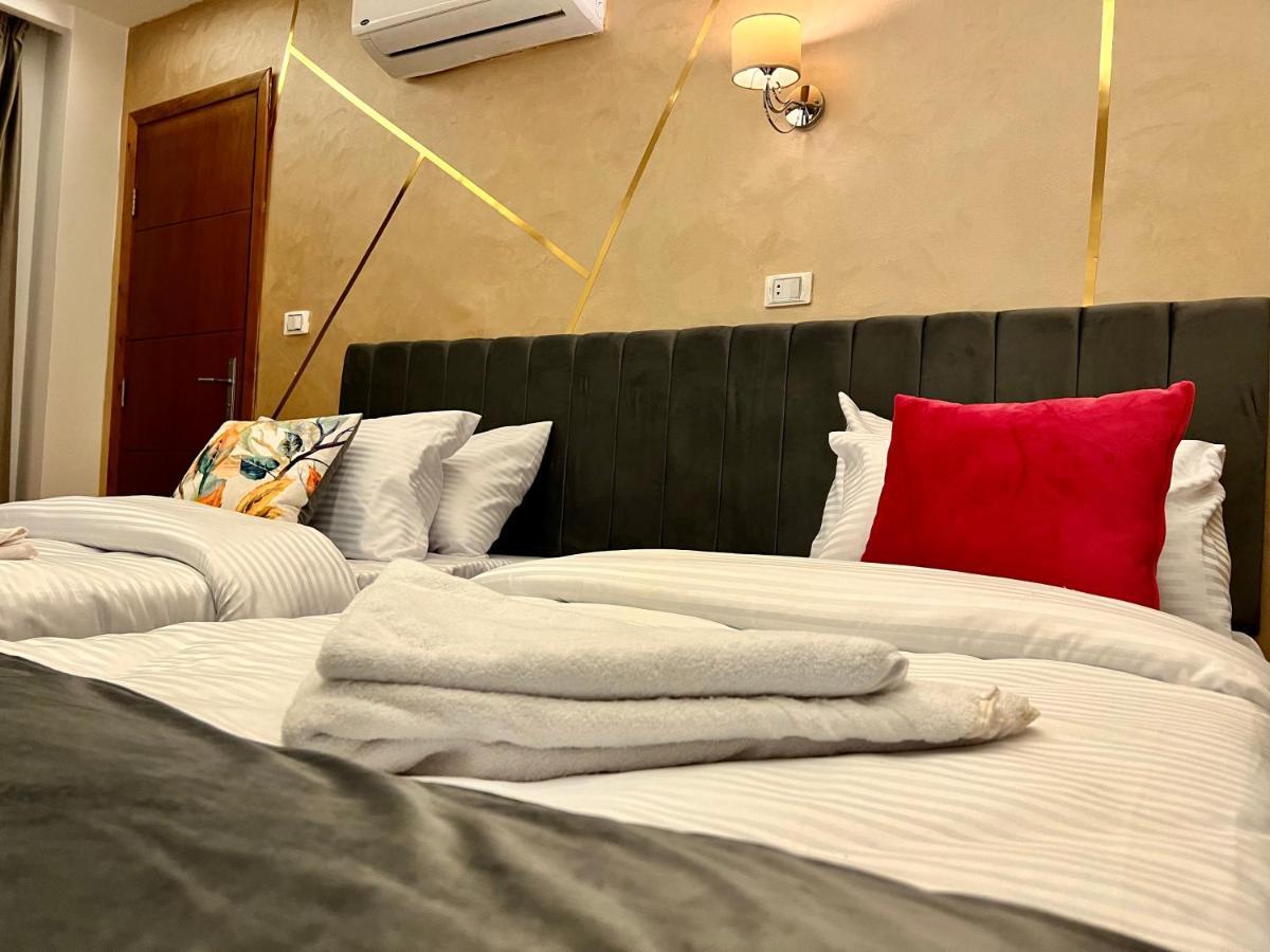 Grand Pyramids Inn Kafret el-Gabal Esterno foto