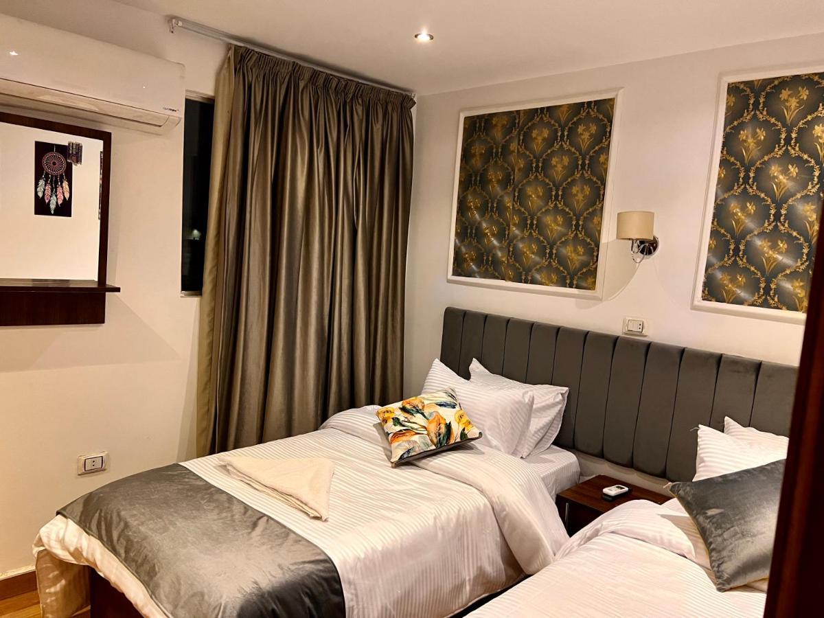 Grand Pyramids Inn Kafret el-Gabal Esterno foto