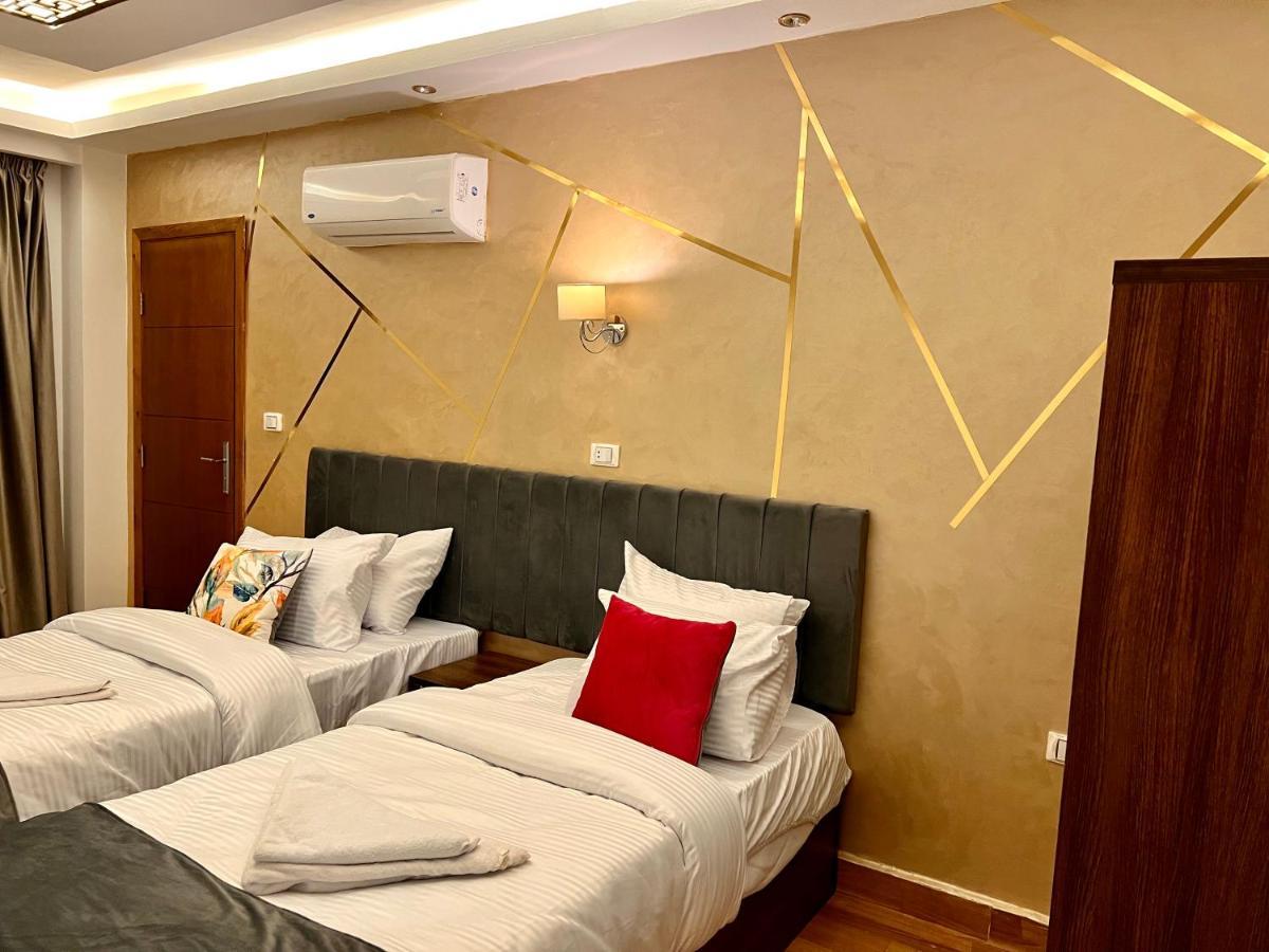 Grand Pyramids Inn Kafret el-Gabal Esterno foto
