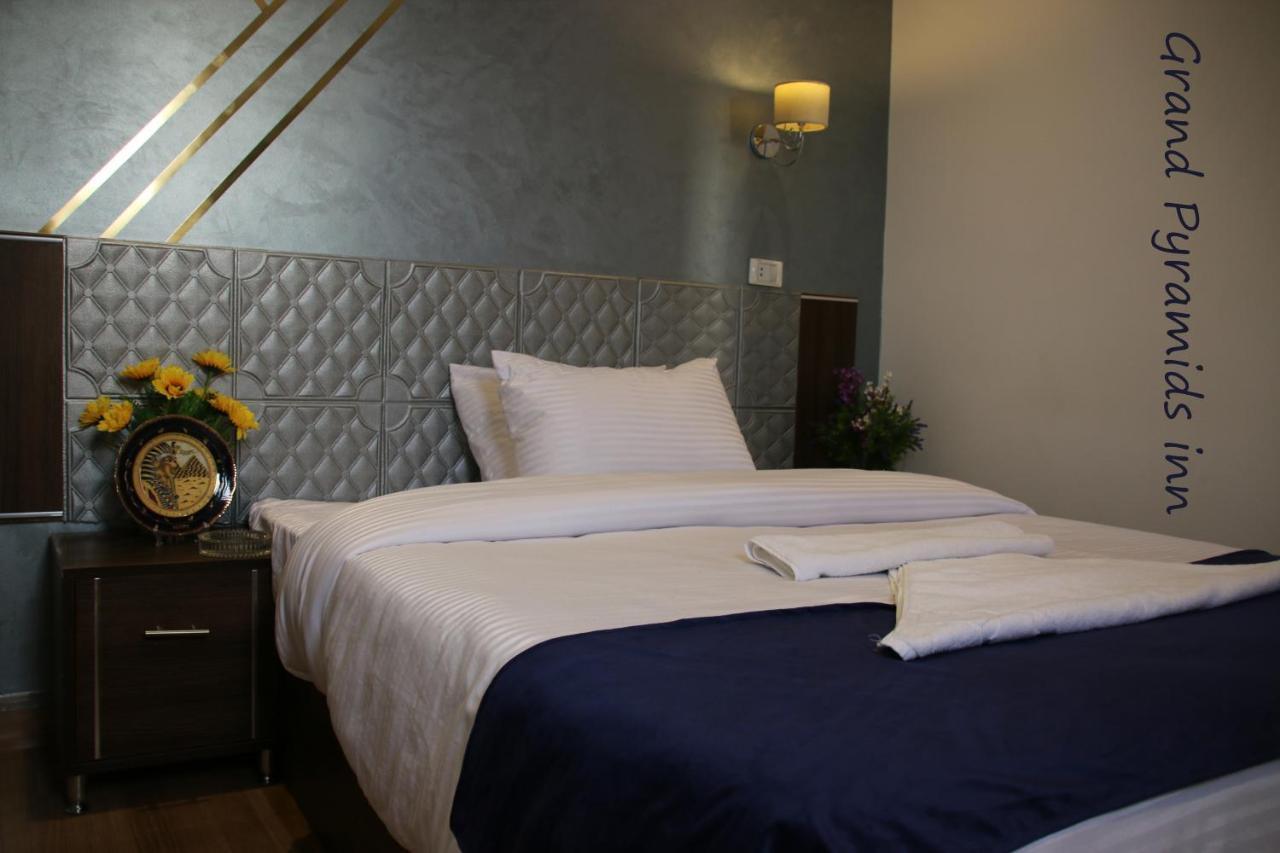 Grand Pyramids Inn Kafret el-Gabal Esterno foto