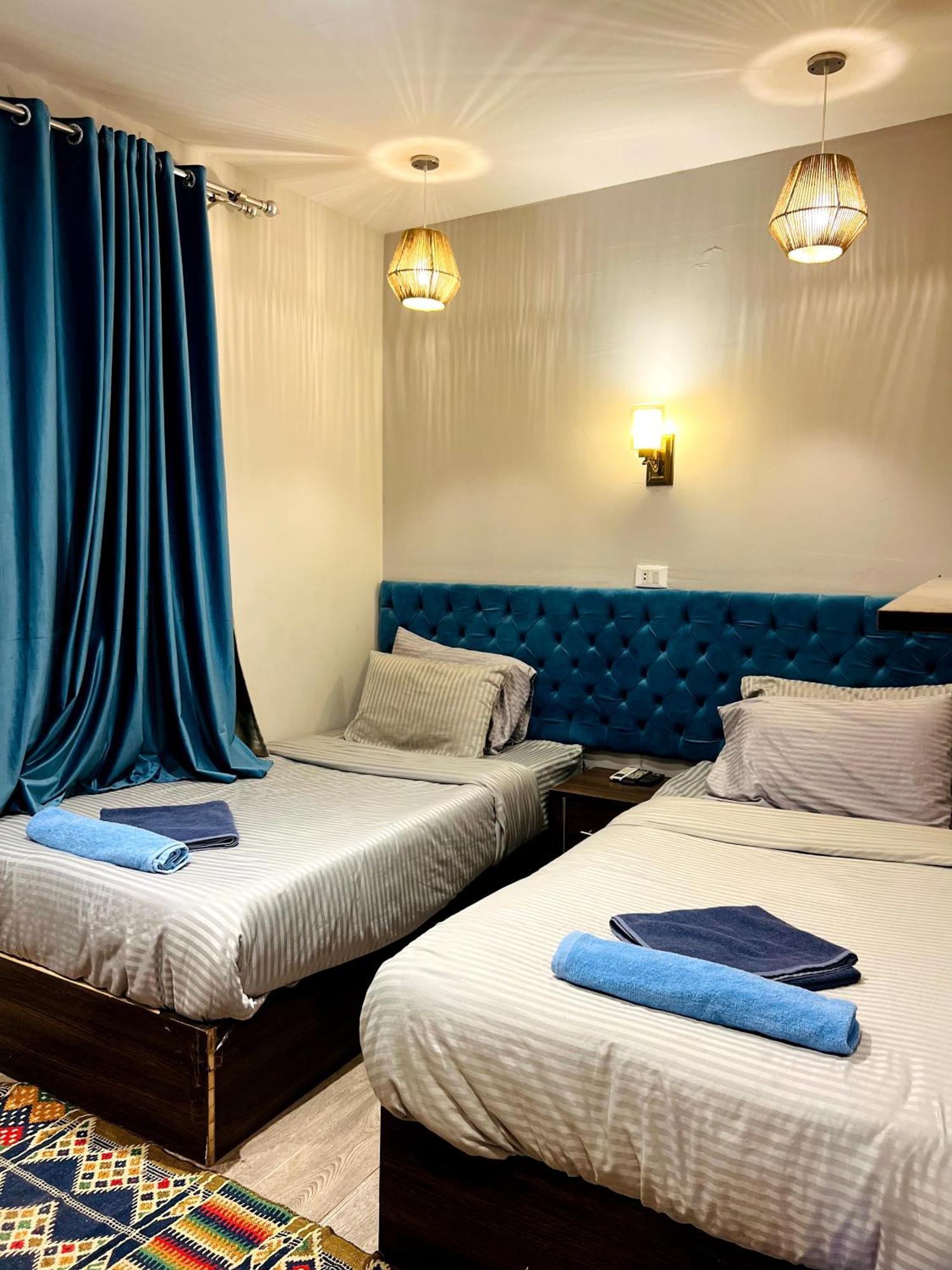 Grand Pyramids Inn Kafret el-Gabal Esterno foto